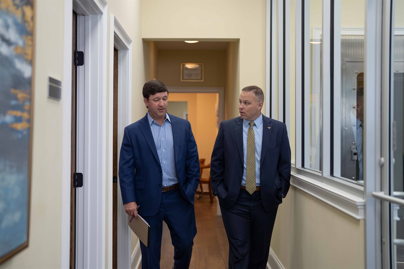 Heyward Barnes and Trey Bruner of Four Lights Advisors walking through their Leesville office